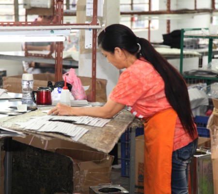 Gluing PU material is glued to lining by workers