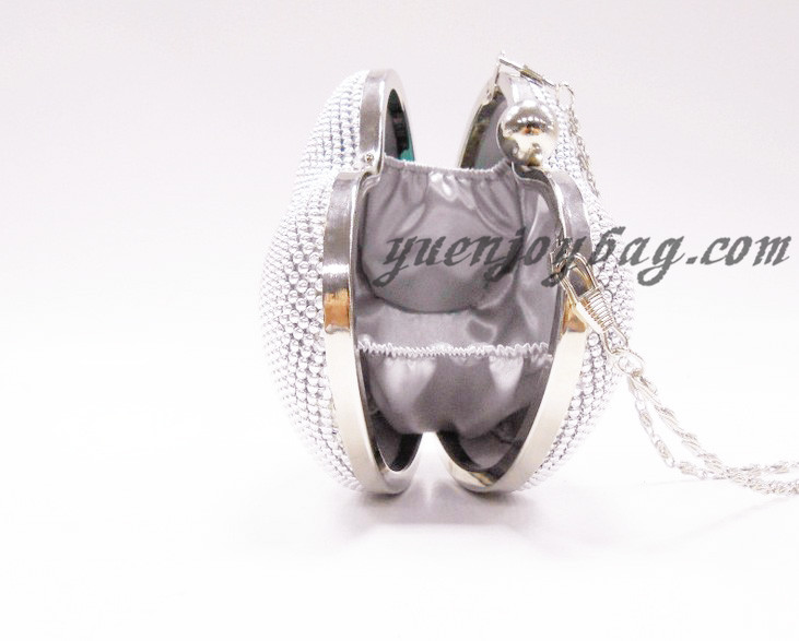 Heart shaped aluminium beaded cross body bag side view Heart shaped aluminium beaded cross body bag side view