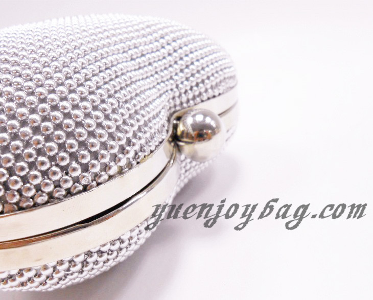 Ladies' Heart shaped aluminium beaded clutch bag detail view Ladies' Heart shaped aluminium beaded clutch bag detail view