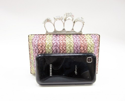 Skull finger rings woven PU clutch bag contrast with mobile