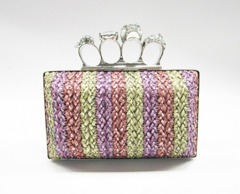 Skull finger rings woven PU clutch bag front view