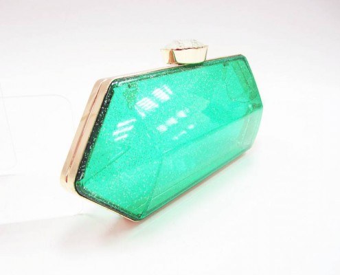 Acrylic clear evening clutch bag with gold metal frame - side view Acrylic clear evening clutch bag with gold metal frame - side view
