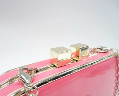 Gold metal frame patent PU faux leather candy clutch bag - detail view Gold metal frame patent PU faux leather candy clutch bag - detail view