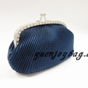 Pleated satin evening bag with kiss lock metal frame - side view Pleated satin evening bag with kiss lock metal frame - side view