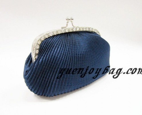 Pleated satin evening bag with kiss lock metal frame - side view Pleated satin evening bag with kiss lock metal frame - side view